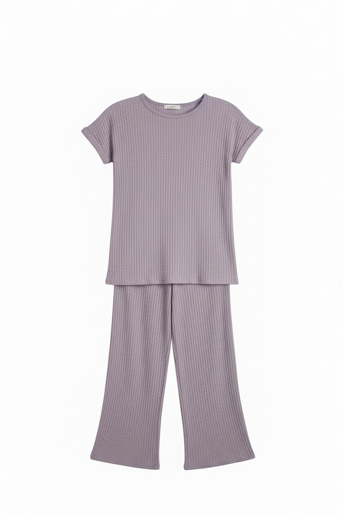 A two-piece children's loungewear set in a dusty lavender-purple ribbed knit fabric, featuring a short-sleeve crewneck top and matching wide-leg pants, displayed on a clean white background.