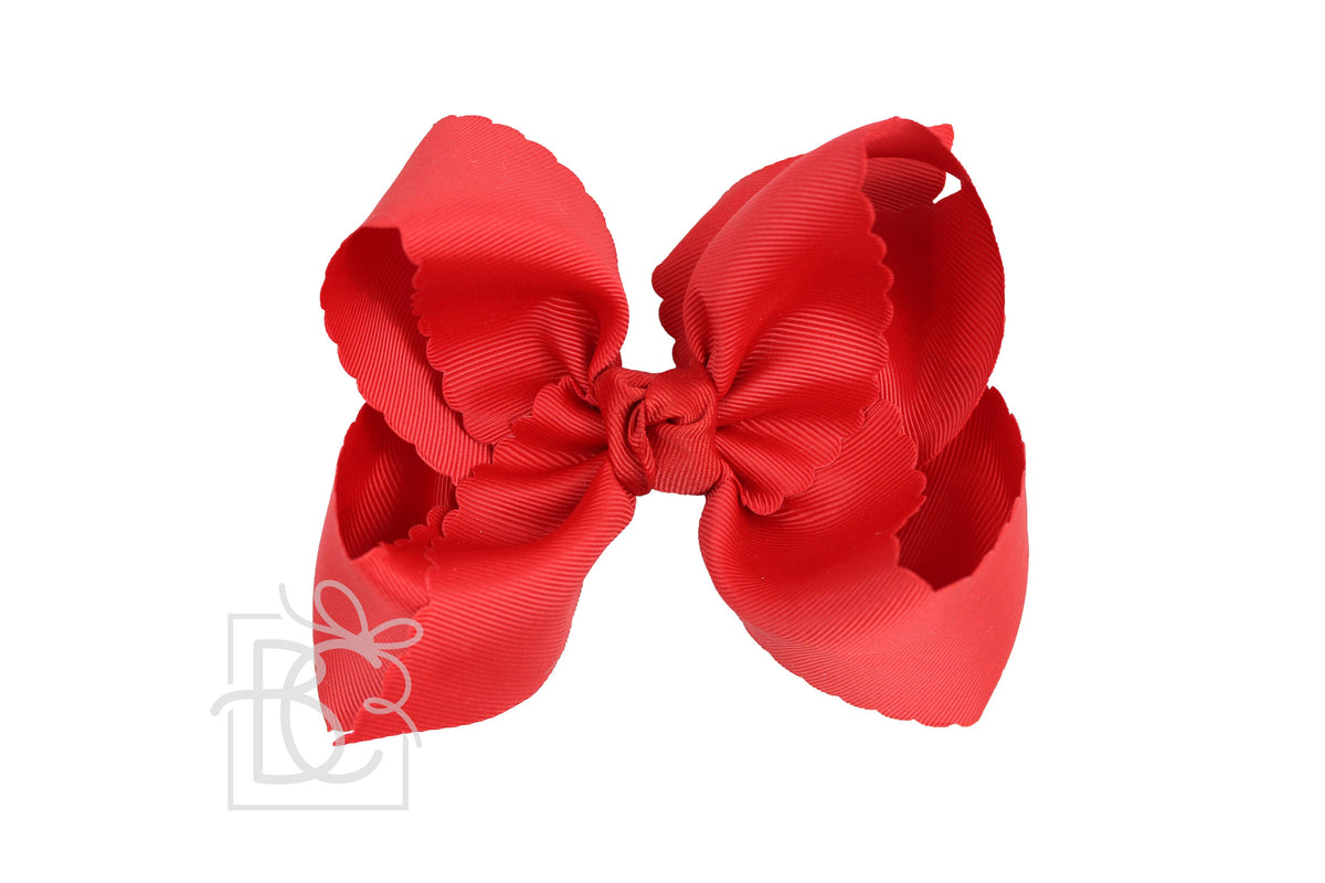 Red hair bow on a white background