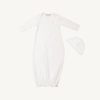 A white long-sleeve baby sleep sack with a matching bonnet, displayed flat against a solid off-white background.