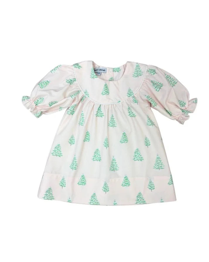A baby girl's short-sleeve smocked dress in a warm cream color, decorated with a repeating pattern of small green pine trees. The dress features puffed sleeves, a smocked bodice, and a tiered skirt, shown flat on a white background.
