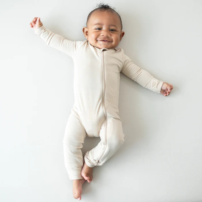 KYTE BABY ZIPPERED ROMPER IN BISQUE