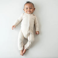 KYTE BABY ZIPPERED ROMPER IN BISQUE