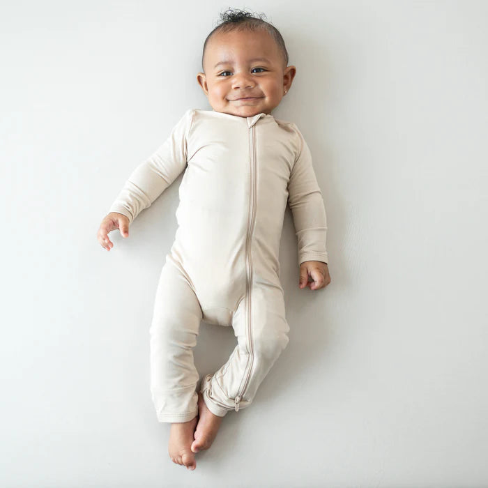 KYTE BABY ZIPPERED ROMPER IN BISQUE