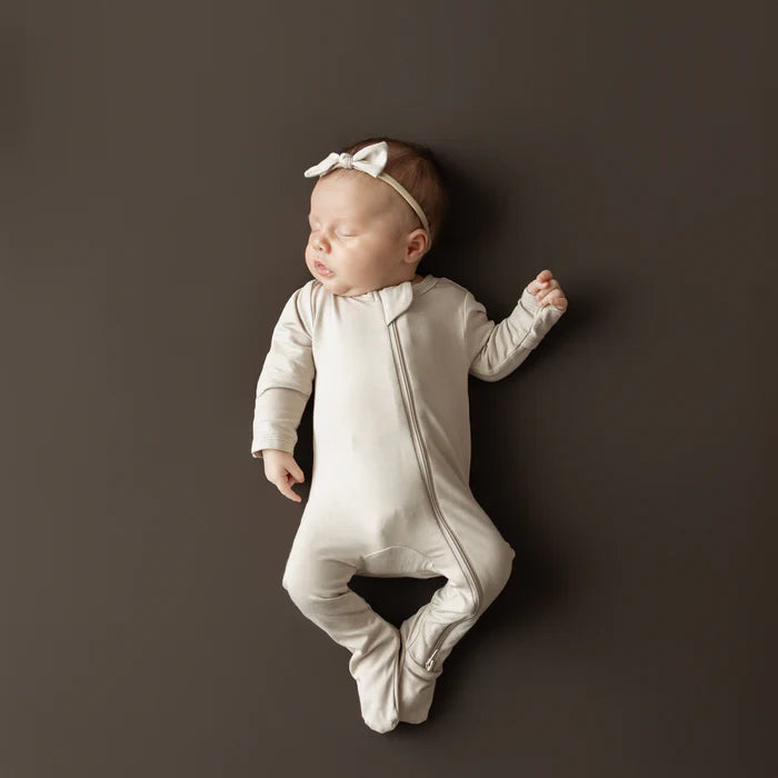 KYTE BABY ZIPPERED FOOTIE IN BISQUE