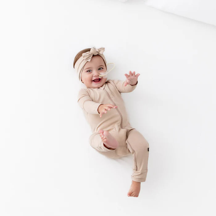 KYTE BABY ZIPPERED ROMPER IN BISQUE