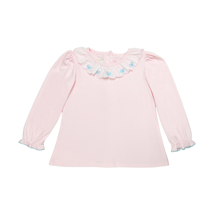 A light pink long-sleeve baby top with a ruffled collar decorated with small blue bows, shown on a plain white background.