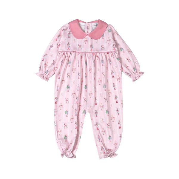 Pink baby onesie with a pattern on a white background