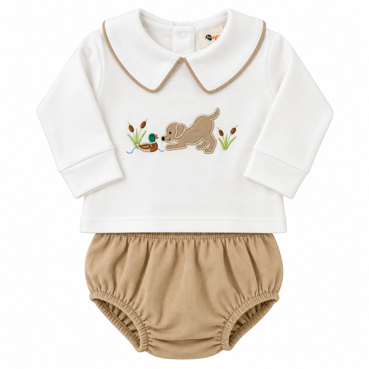 A baby two-piece outfit featuring a white long-sleeve top with a tan collar and embroidered duck hunting scene, paired with tan bloomers.