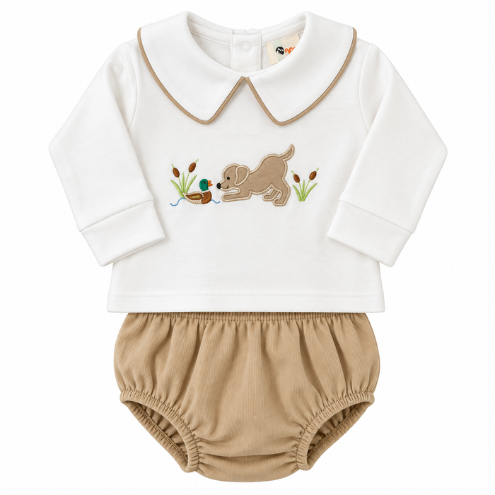 A baby two-piece outfit featuring a white long-sleeve top with a tan collar and embroidered duck hunting scene, paired with tan bloomers.