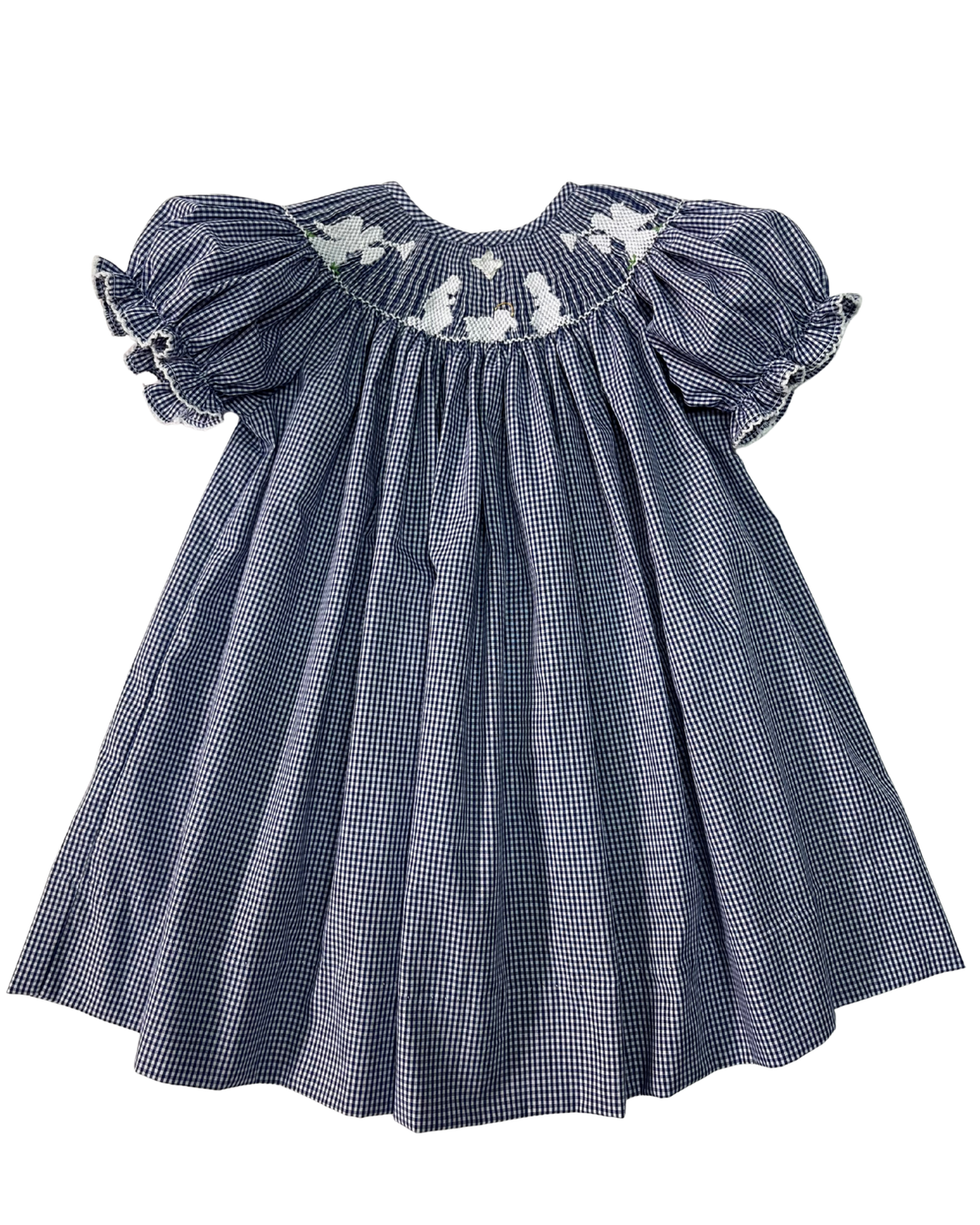 A navy and white gingham baby dress with puff sleeves and white floral embroidery around the smocked neckline, shown against a plain white background.