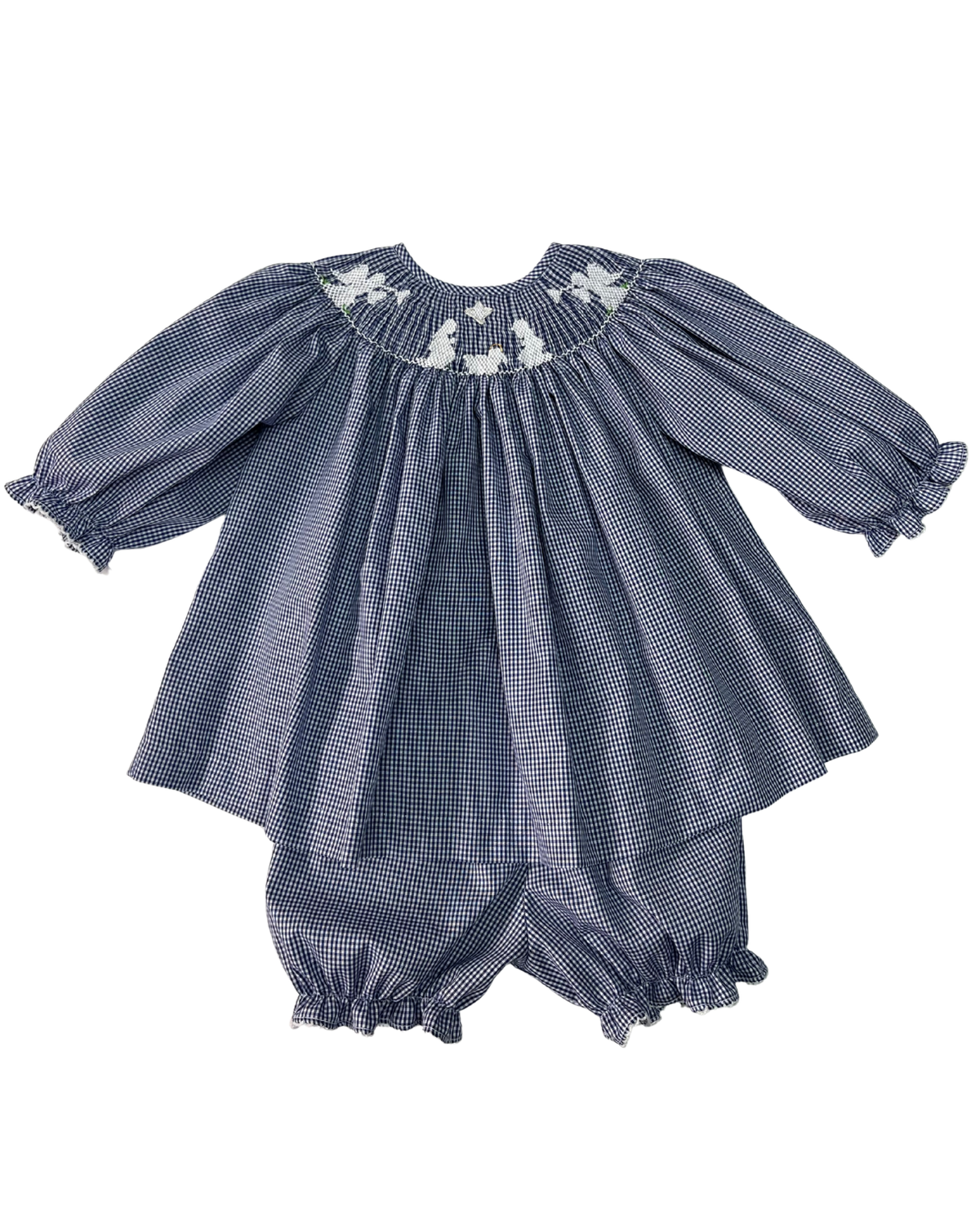 A baby girl's two-piece outfit featuring a smocked long-sleeve smocked romper top in a blue and white gingham pattern with white floral embroidery at the neckline, paired with matching smocked bloomers.