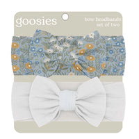 Goosies bow headbands set of two, featuring a light blue floral patterned headband and a solid white headband, both with large bows, on a beige backing card.