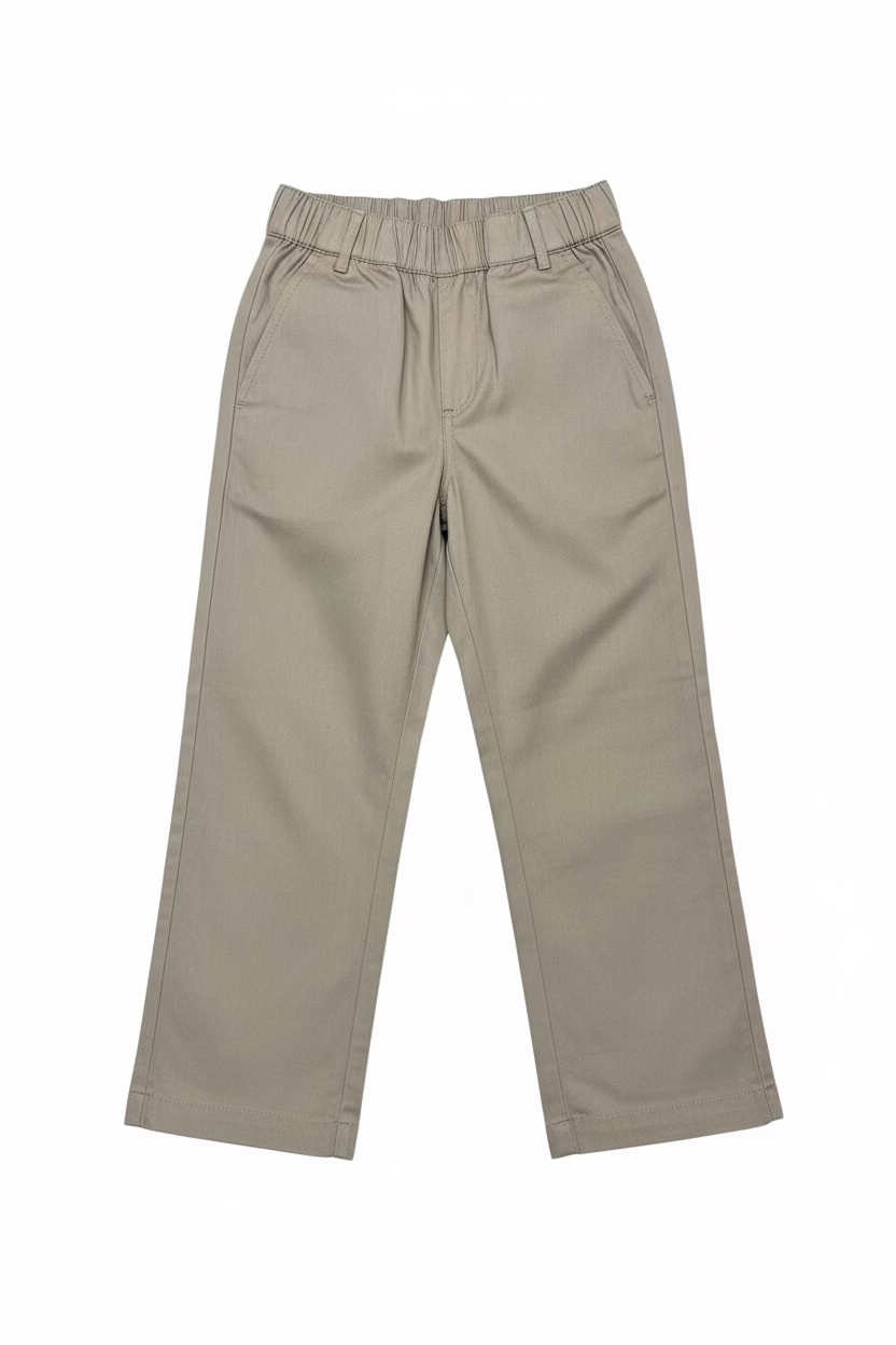 A pair of beige wide-leg cropped pants with an elastic waistband, hanging on a clear plastic hanger in a retail or warehouse setting with shoe boxes stacked on shelves in the background.