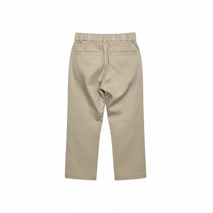 A pair of beige elastic-waist cropped pants hanging on a clear plastic hanger, set against a store background with shoe boxes on shelves.