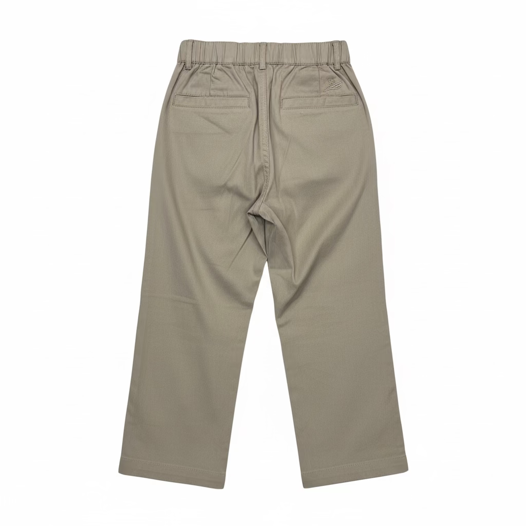 A pair of beige cropped pants with an elastic waistband, hanging on a clear plastic hanger in a retail or warehouse setting with shoe boxes stacked on shelves in the background.