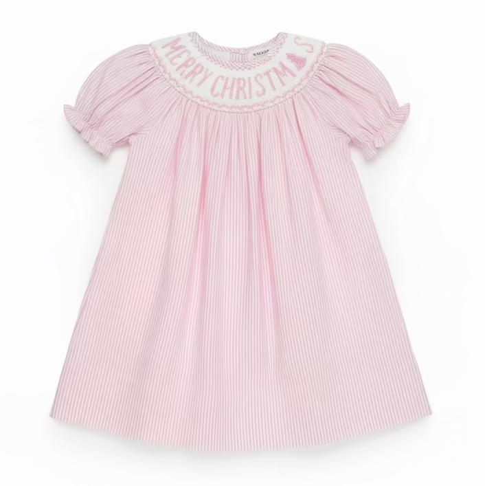 A pink and white vertically striped baby dress with short puff sleeves and 'MERRY CHRISTMAS' embroidered on the yoke, hanging on a clear hanger in a retail store.