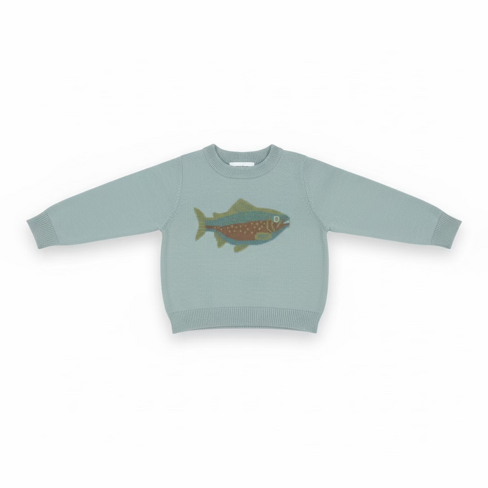 A light sage green knit sweater for toddlers, featuring a colorful fish graphic on the chest, hanging on a clear plastic hanger on a store shelf.