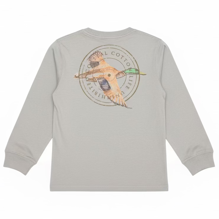 A light gray long-sleeve t-shirt with a large circular duck hunting graphic on the back, hanging on a hanger in a retail store setting with shoe boxes visible in the background.