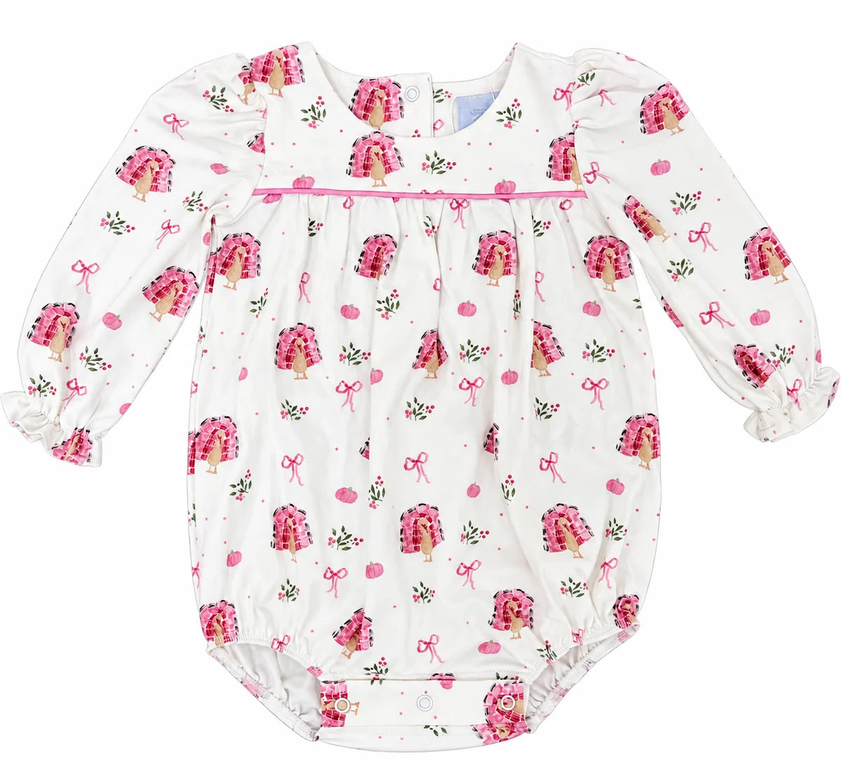 A baby long-sleeve bodysuit with a white base, featuring an all-over print of pink cupcakes, pink bows, and small green leaves. The bodysuit has a smocked chest panel with a pink ribbon detail and ruffled cuffs.