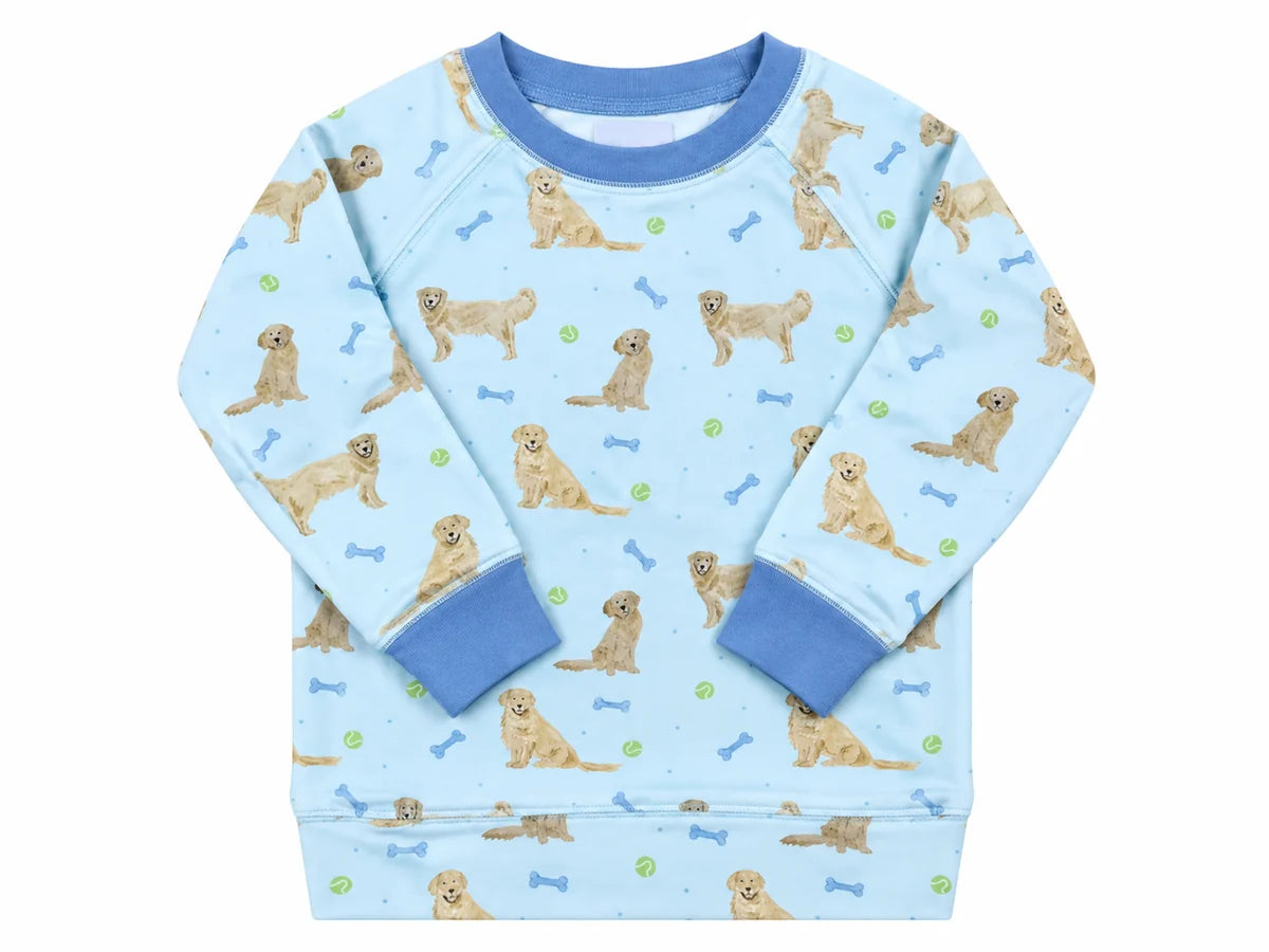 A light blue long-sleeve children's sweatshirt featuring an all-over print of golden retriever dogs, blue bones, and green tennis balls, with solid blue ribbed collar, cuffs, and hem.