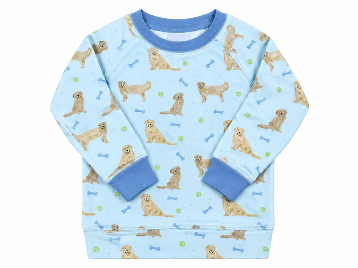 A light blue long-sleeve children's sweatshirt featuring an all-over print of golden retriever dogs, blue bones, and green tennis balls, with solid blue ribbed collar, cuffs, and hem.