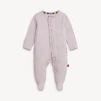 Pink baby onesie with ruffled details on a white background