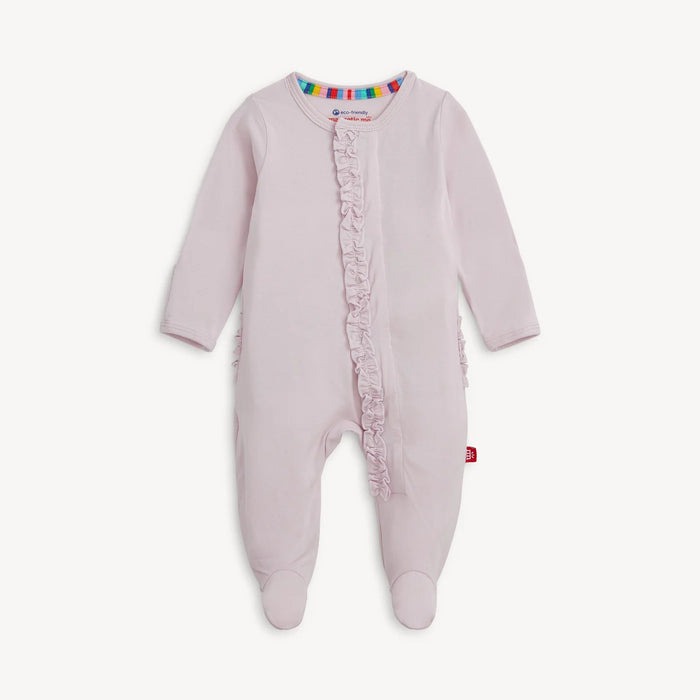 Pink baby onesie with ruffled details on a white background