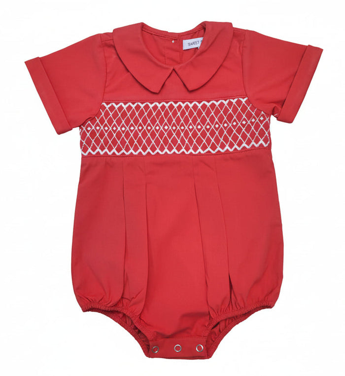 A baby romper in red with a white smocked diamond pattern across the chest and a short Peter Pan collar, shown flat on a white background.
