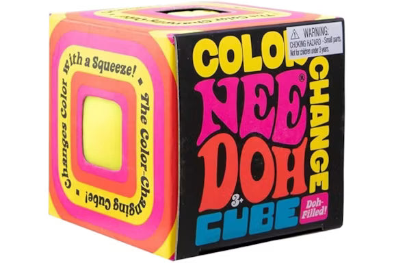 A colorful product box for the 'Color Change Nee Doh Cube' on a plain white background. The packaging features bold text in yellow, pink, orange, and blue on a black background, with a yellow square window on the side showing the cube inside.