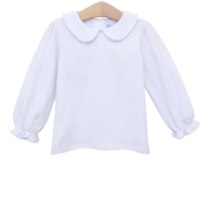A white long-sleeve baby top with a Peter Pan collar and ruffled cuffs, hanging on a wooden hanger against a white background.