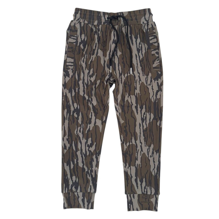 A pair of jogger-style pants featuring an abstract bark-like camouflage pattern in shades of brown, gray, and beige, with a dark drawstring waistband and ribbed cuffs.