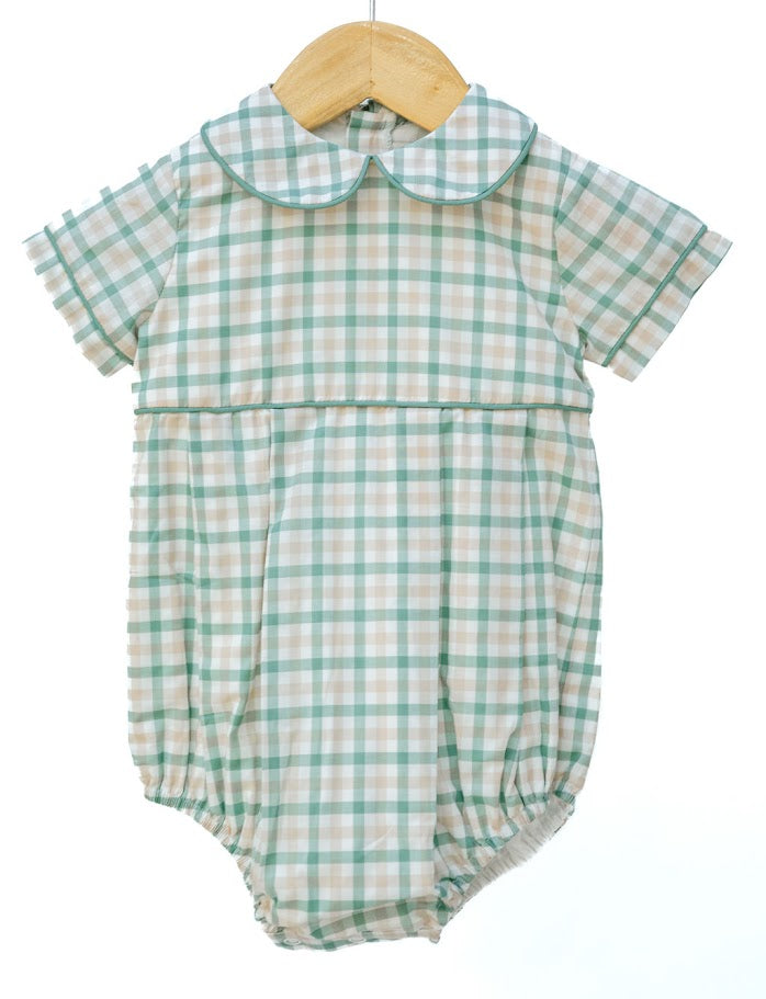 Green and white checkered baby romper on a wooden hanger against a white background