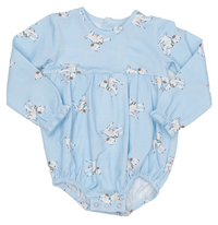 A baby long-sleeve bodysuit in light blue, featuring an all-over print of white cows with brown details. The bodysuit has a gathered waist and elasticized cuffs.