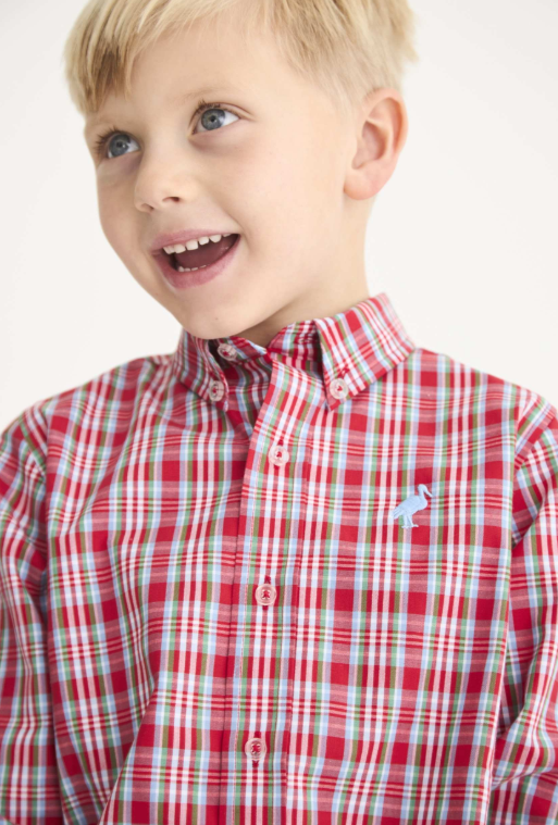 A young boy with blond hair and blue eyes wearing a red, white, and light blue plaid button-down shirt with a small light blue embroidered rabbit logo on the chest, set against a plain white background.