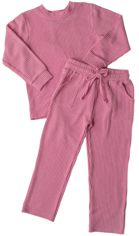 A two-piece children's pajama set in pink and white vertical stripes, featuring a long-sleeve crewneck top and matching drawstring pants, laid flat on a white background.