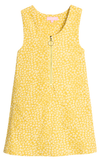A sleeveless yellow dress with a dense white floral print, featuring a front zipper with a decorative ring pull, photographed against a solid white background.