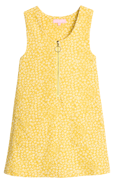 A sleeveless yellow dress with a dense white floral print, featuring a front zipper with a decorative ring pull, photographed against a solid white background.