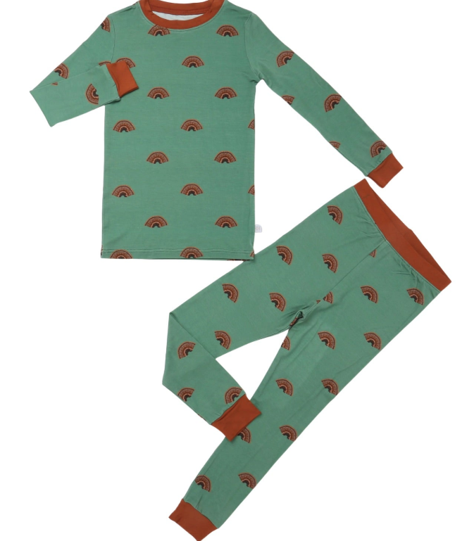 A two-piece children's pajama set featuring a long-sleeve top and matching pants in sage green with a repeating brown rainbow pattern and contrasting rust-orange cuffs, collar, and waistband.