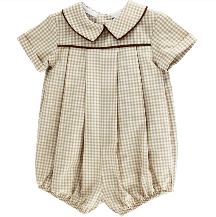 A baby girl's short-sleeve romper in a beige and white gingham check pattern, featuring a dark brown piped Peter Pan collar and a matching horizontal trim across the chest.