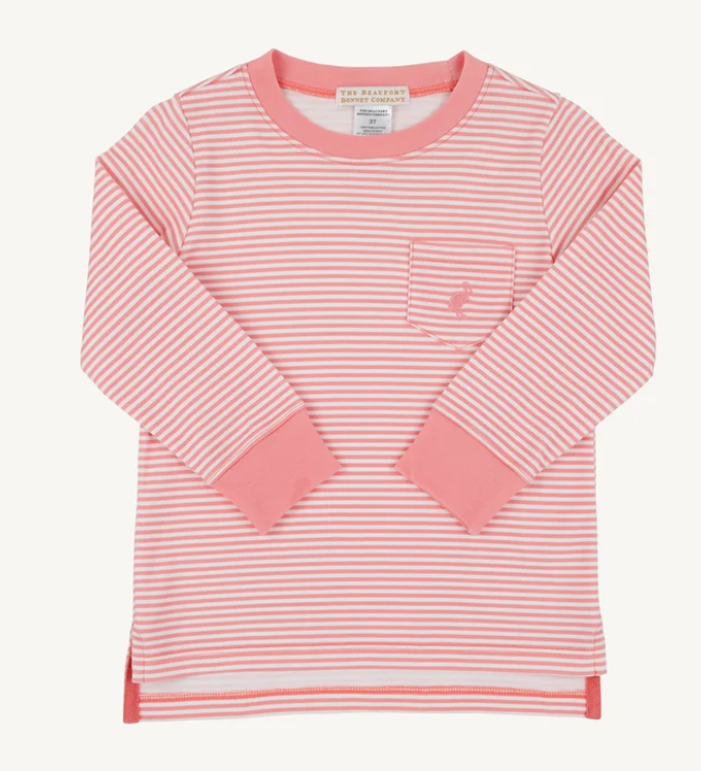 A pink and white striped long-sleeve t-shirt with a chest pocket, laid flat against a light off-white background. The brand 'The Petites Bruges' is visible on the inner neck label.
