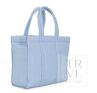 A light blue and white vertically striped canvas tote bag with two top handles, shown on a plain white background with a faint 'TRVL design' watermark.