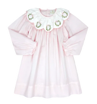 A light pink long-sleeve baby dress with a large white ruffled collar decorated with embroidered floral motifs, shown against a solid gray background.