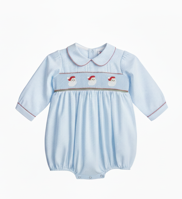 A light blue gingham baby romper with three embroidered Santa Claus faces across the chest, finished with red and gold smocked trim and a white collar, hanging on a black hanger against a white background.