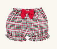 A pair of baby bloomers with a red, green, and white plaid pattern, featuring a large red bow at the waistband and ruffled hems, shown against a plain off-white background.
