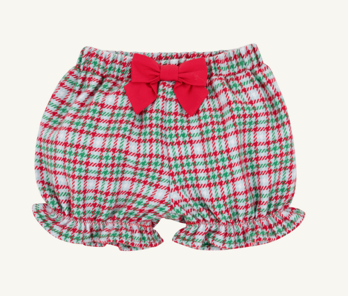 A pair of baby bloomers with a red, green, and white plaid pattern, featuring a large red bow at the waistband and ruffled hems, shown against a plain off-white background.