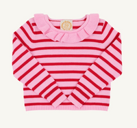 A pink and red striped knit sweater for toddlers, featuring a ruffled collar and long sleeves, laid flat against a light cream background.