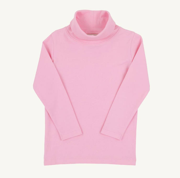 A light pink long-sleeve turtleneck top laid flat against a light off-white background.
