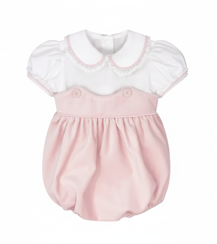 A baby bubble romper dress featuring a white short-sleeve top with a Peter Pan collar and lace trim, paired with a soft pink skirt and button details on the chest, shown against a solid gray background.