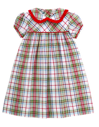 A short-sleeve baby dress with a white plaid pattern featuring red, green, and blue lines, a red ruffled Peter Pan collar, and red trim along the sleeve cuffs.