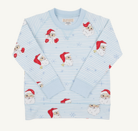 A light blue long-sleeve pajama top with a striped pattern and an all-over print of cartoon Santa Claus faces and red Santa hats, laid flat on a light cream background.